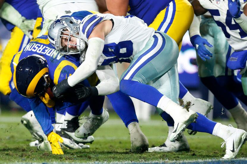 Dallas Cowboys strong safety Jeff Heath (38) stops Los Angeles Rams running back C.J....