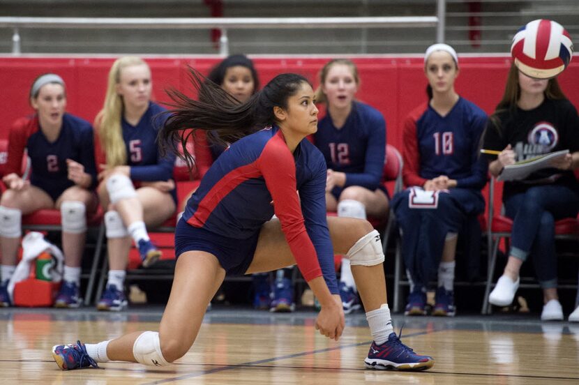 Allen junior outside hitter Lauren Moussaid digs a hit by Southlake Carroll during their...