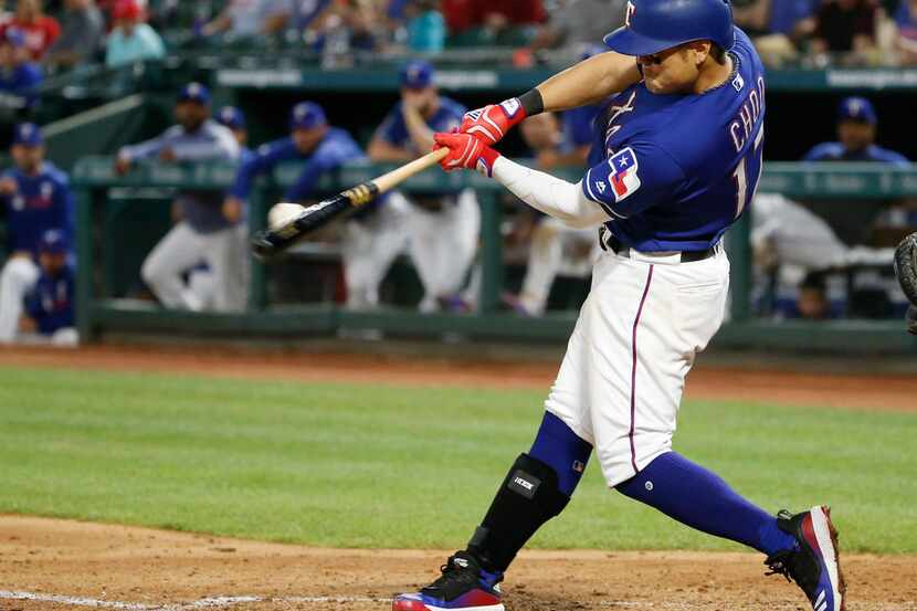 Texas Rangers' Shin-Soo Choo (17) hits a triple against the Los Angeles Angels during the...