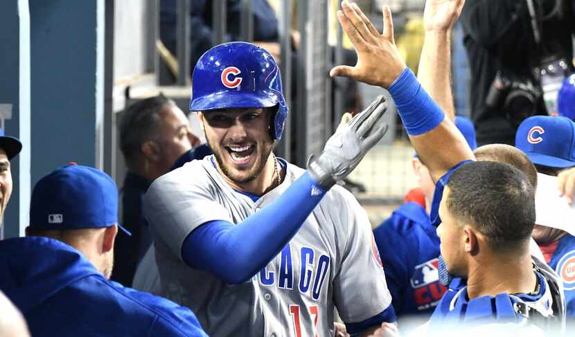 LOS ANGELES, CA - AUGUST 26:  Kris Bryant #17 of the Chicago Cubs celebrates in the dugout...