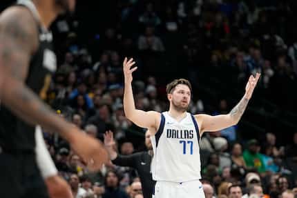 Dallas Mavericks guard Luka Doncic reacts to a bad pass he made to a teammate during the...