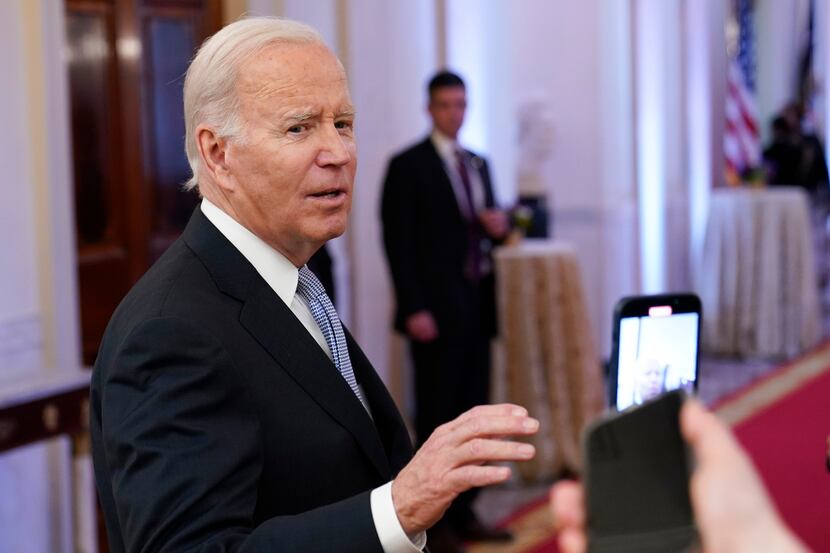 FILE - President Joe Biden talks with reporters after speaking in the East Room of the White...