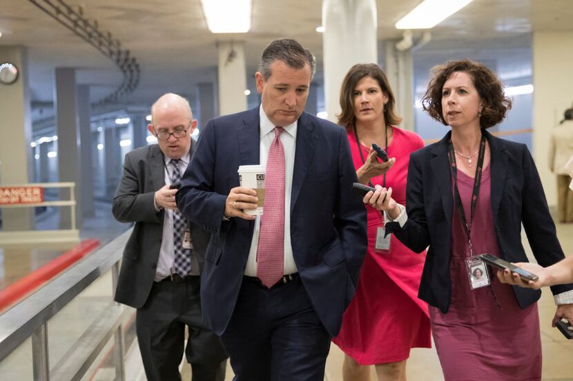 Sen. Ted Cruz, R-Texas, heads to the Senate chamber for a vote in Washington on Thursday,...