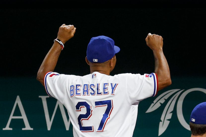 Texas Rangers interim manager Tony Beasley (27) pumps his fists after a game against the...