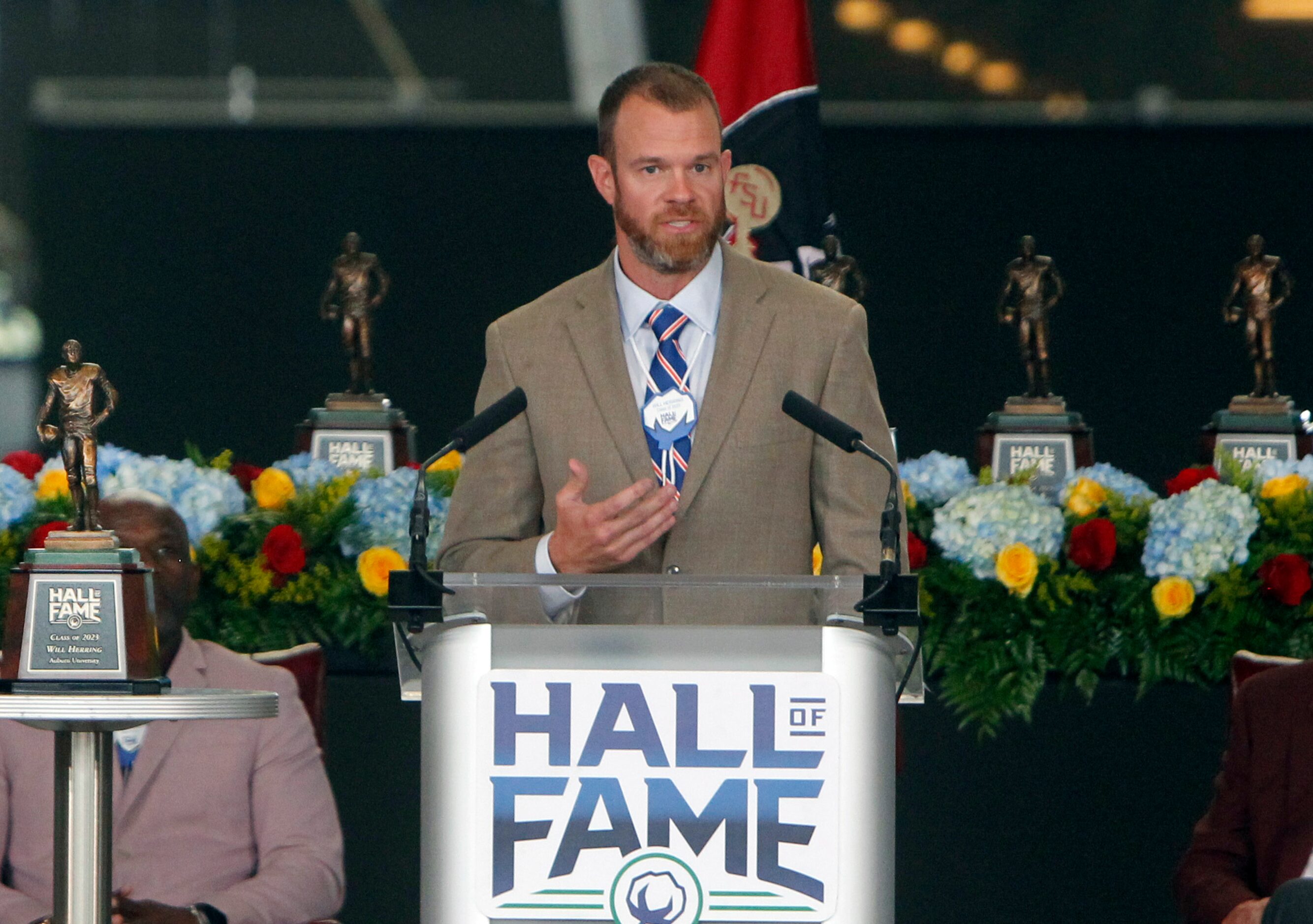 Former Auburn Tigers standout Will Herring delivers a message after being recognized as an...