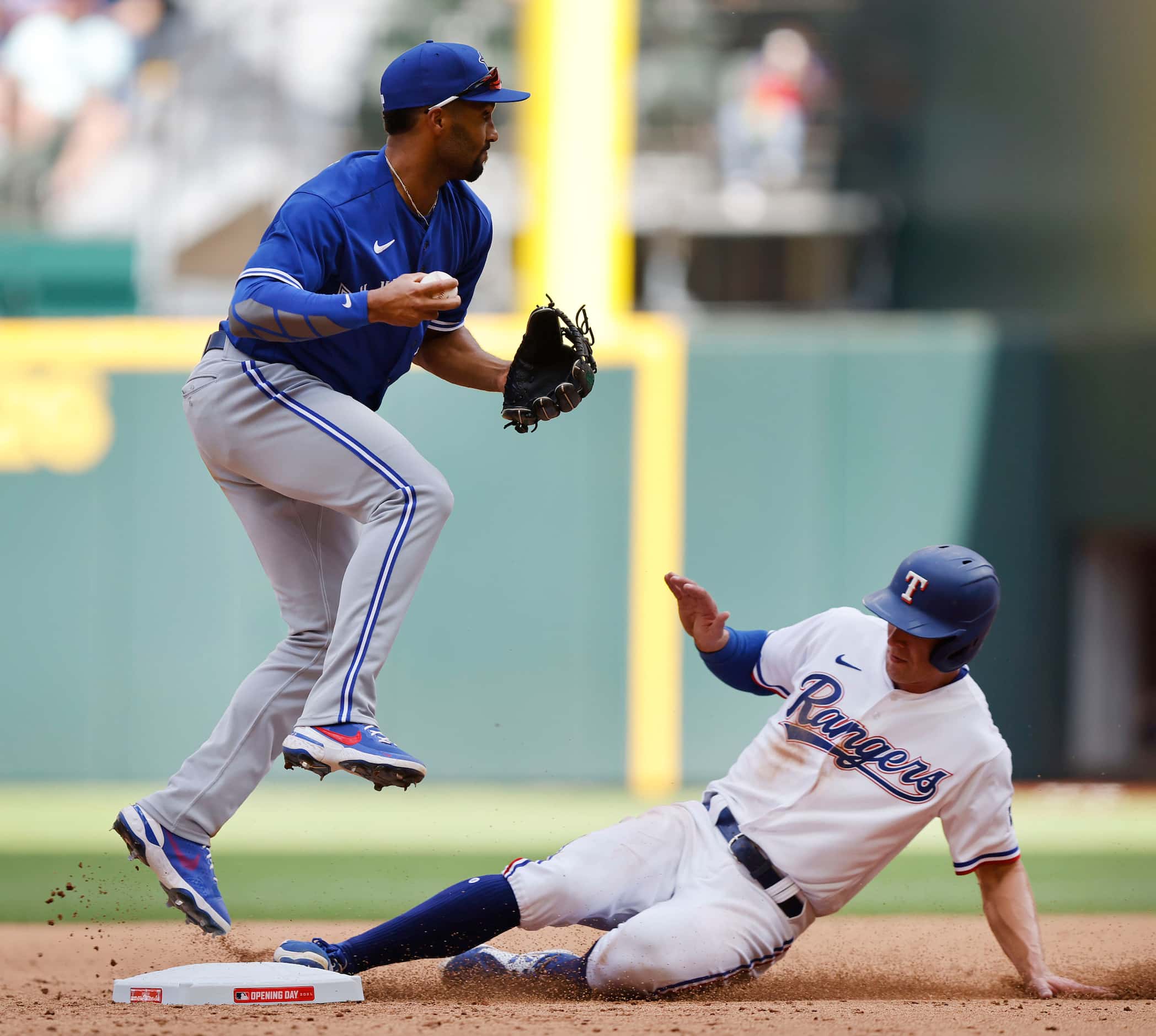 Texas Rangers Eli White (41) is out at second on a fields choice as Toronto Blue Jays...