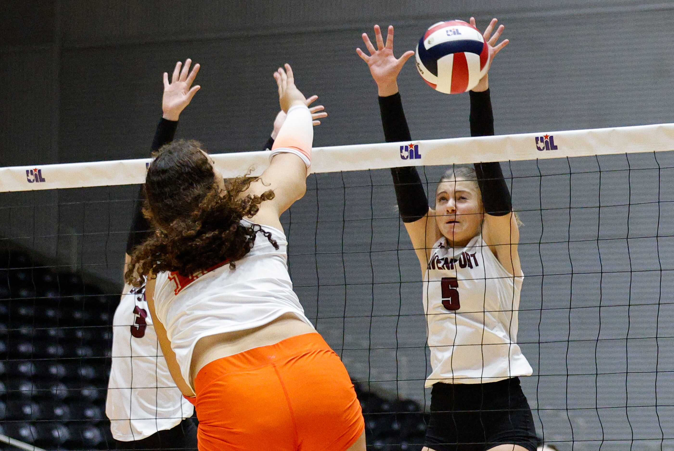 Comal Davenport's Comal Davenport's Lexi Dahl (5) tries to block a spike by Celina's Olivia...