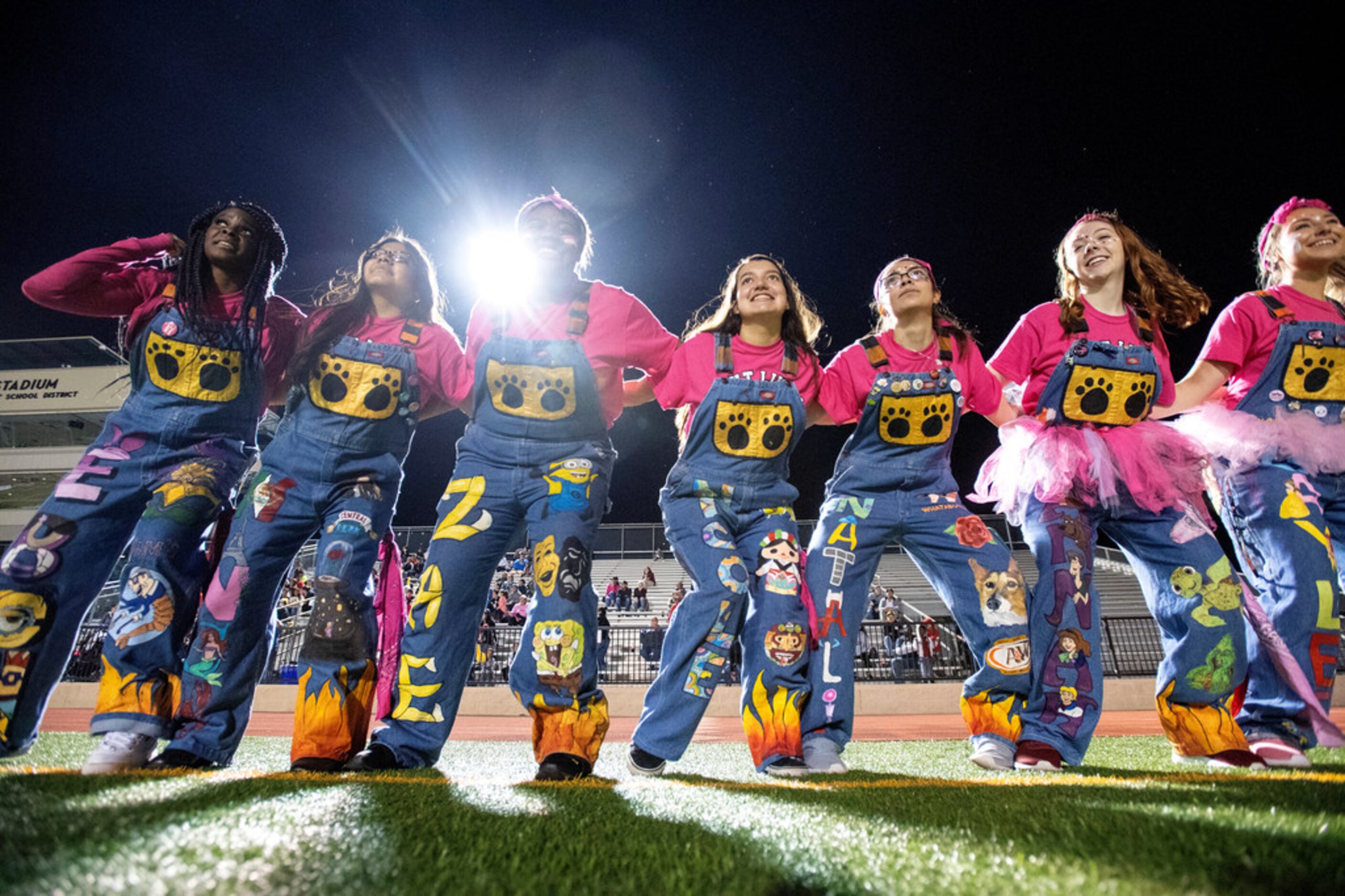 Irving's Tiger Fever spirit squad cheers on the sidelines during the first half of a high...