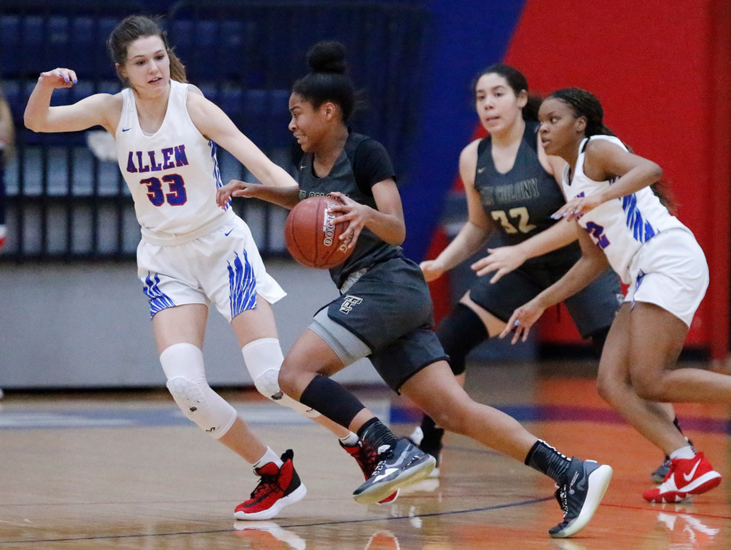 The Colony High Schoolâs Jewel Spear (23) breaks to the basket while Allen High Schoolâs...