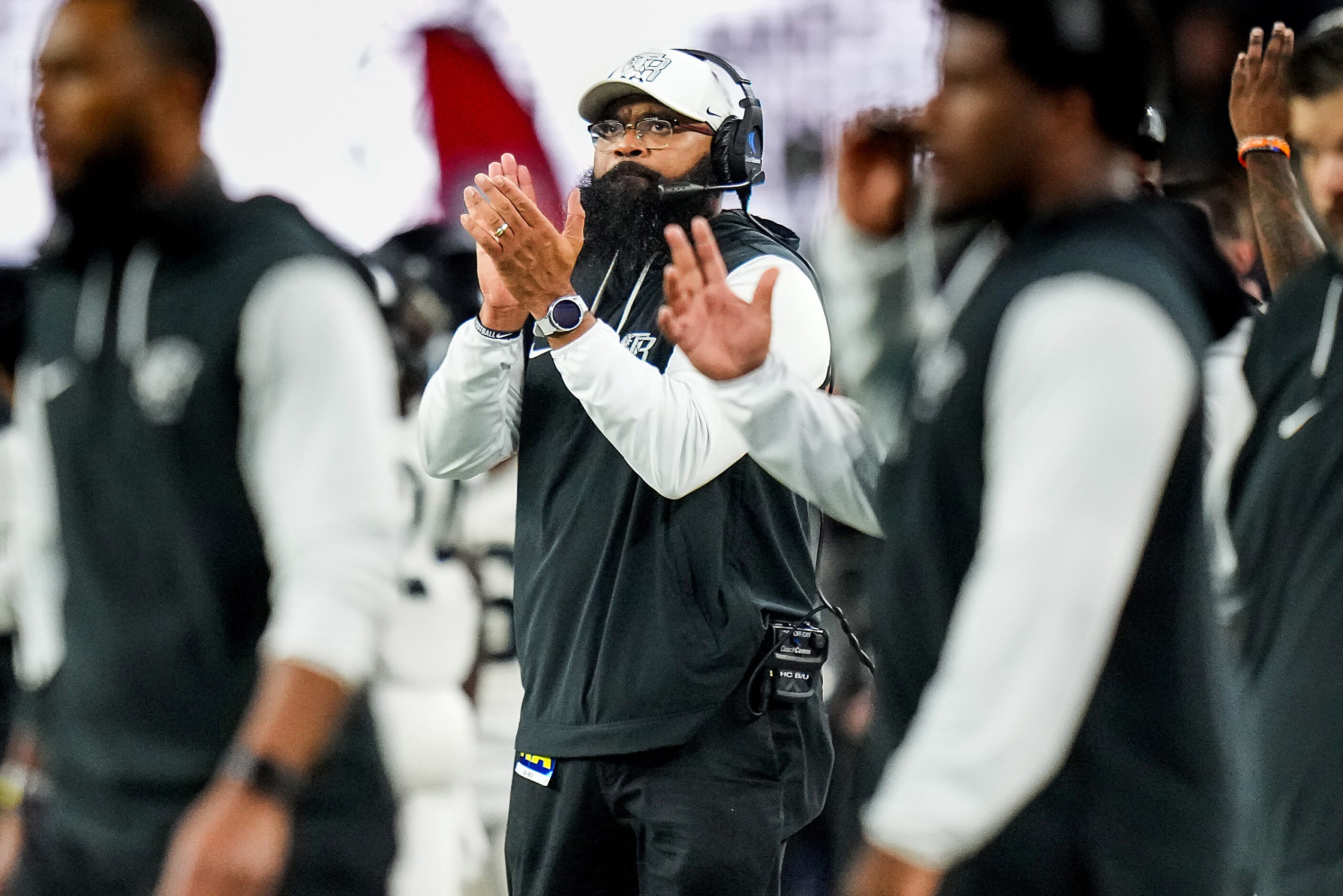 Richmond Randle head coach Brian Randle applauds his team during the second half of the...