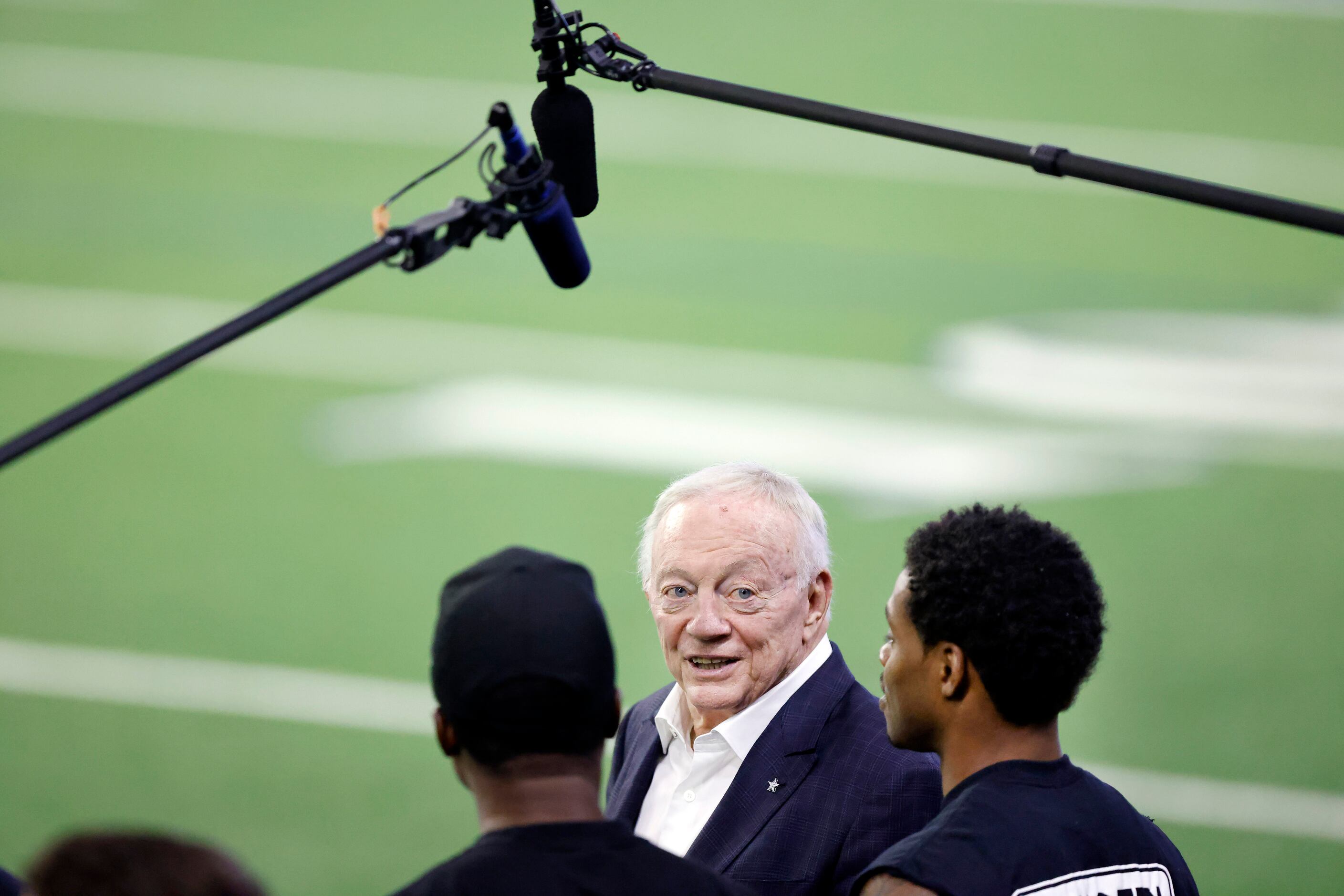 Dallas Cowboys owner Jerry Jones (center) visits with professional boxer Errol Spence Jr. of...