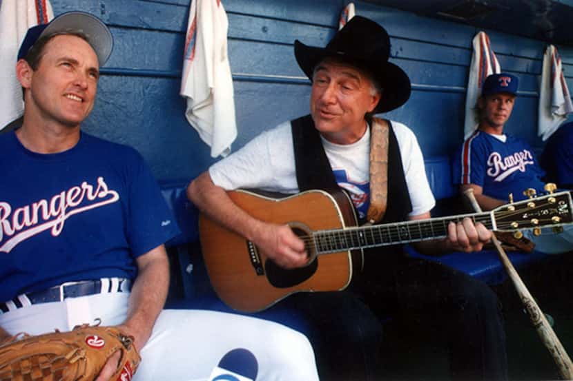  August 2, 1990--Country musicÂ singer Jerry Jeff Walker plays a tune for Nolan Ryan as they...