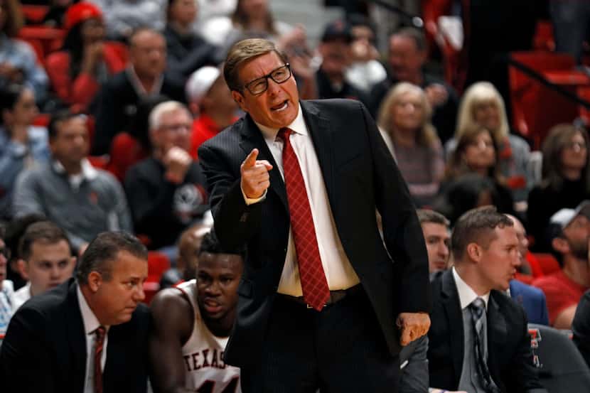 Texas Tech assistant coach Mark Adams yells out to the players during the first half of an...