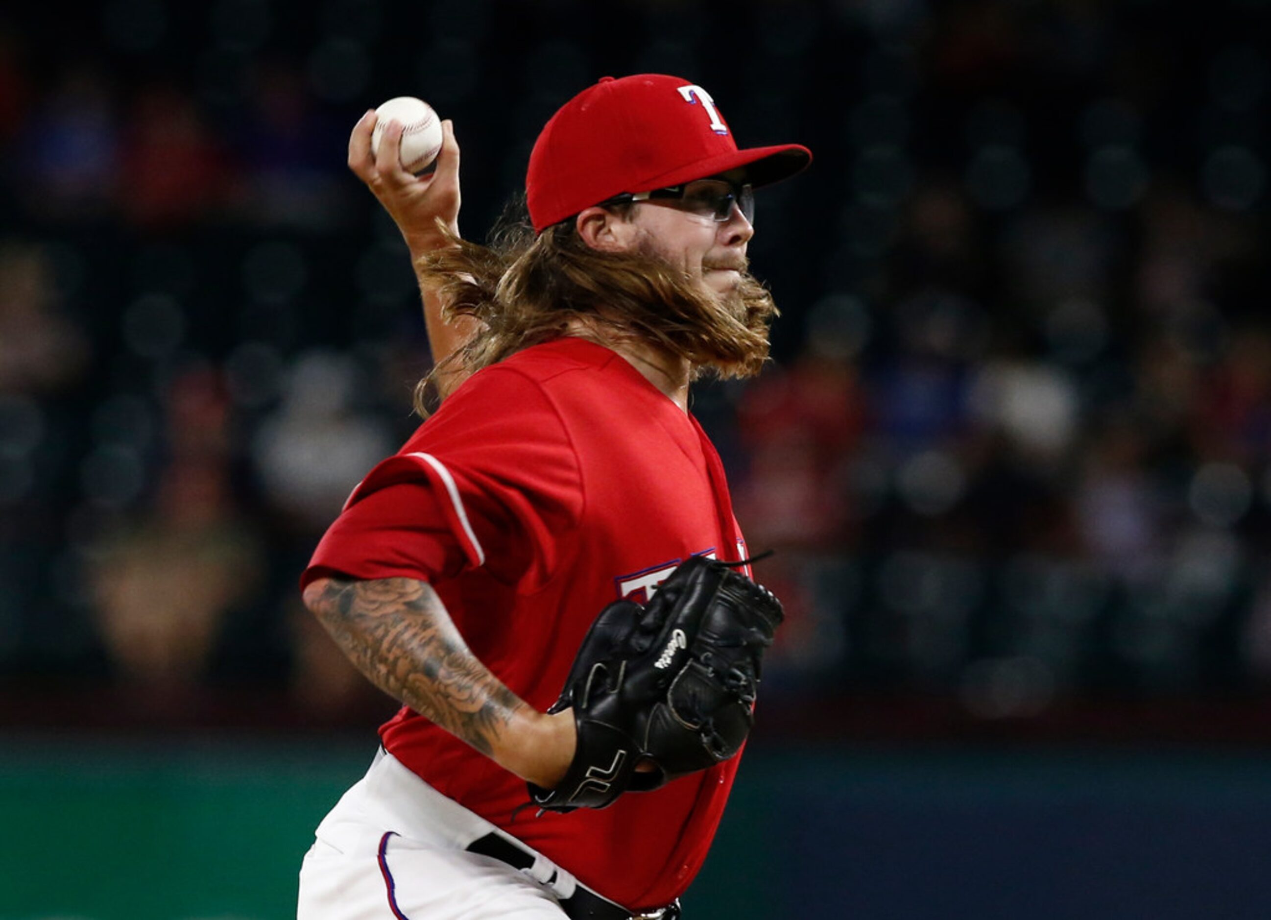 Texas Rangers pitcher Zac Curtis delivers against the Los Angeles Angels during the seventh...