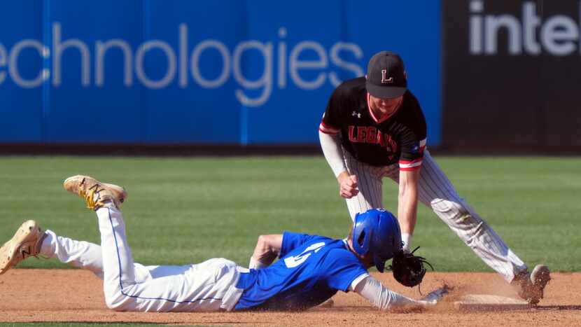 Mansfield Legacy short stop Parker Ibrahimi (right) attempts to tag out Friendswood...