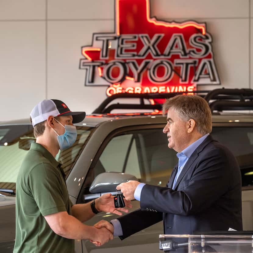 Bob Carter (right), executive vice president of sales for Toyota Motor North America,...