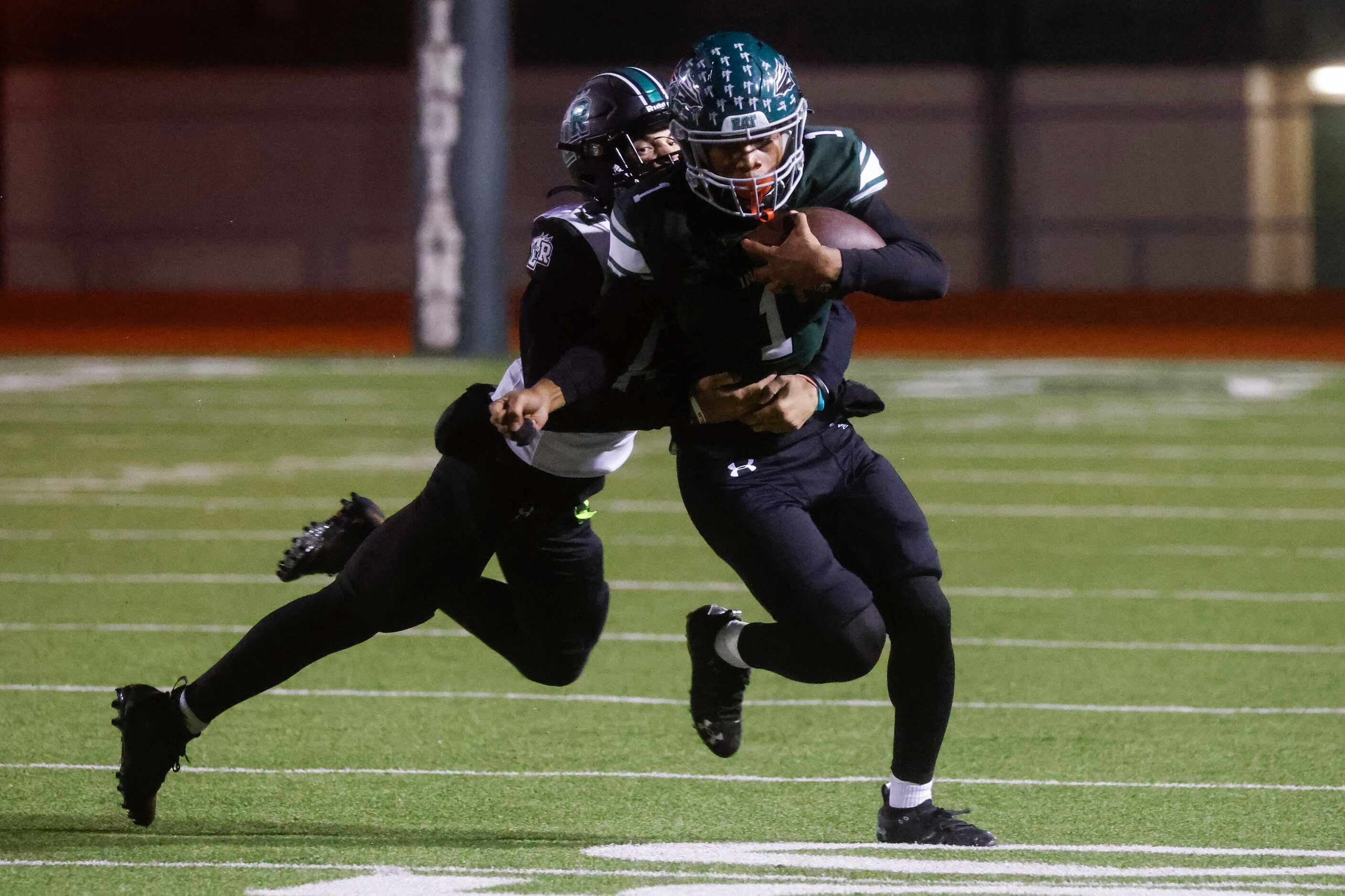 Mansfield Lake Ridge High’s Michael Spencer (5), left, tackles Waxahachie’s Keith Abney II...