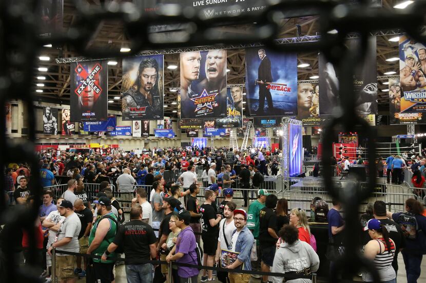 Fans wait in lines during WrestleMania Axxess at the Kay Bailey Hutchison Convention Center...