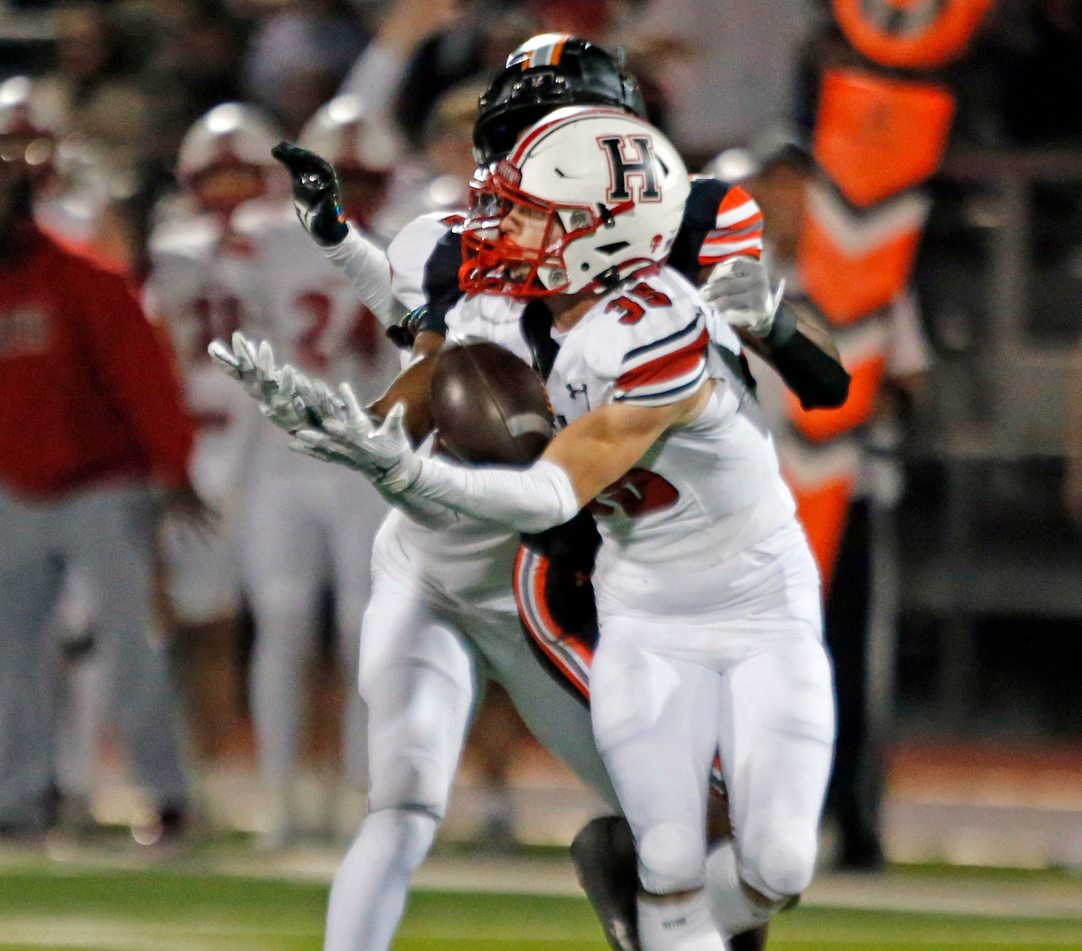 Rockwall Heath High Colton Laughery (35) grabs an interception during the first half of a...