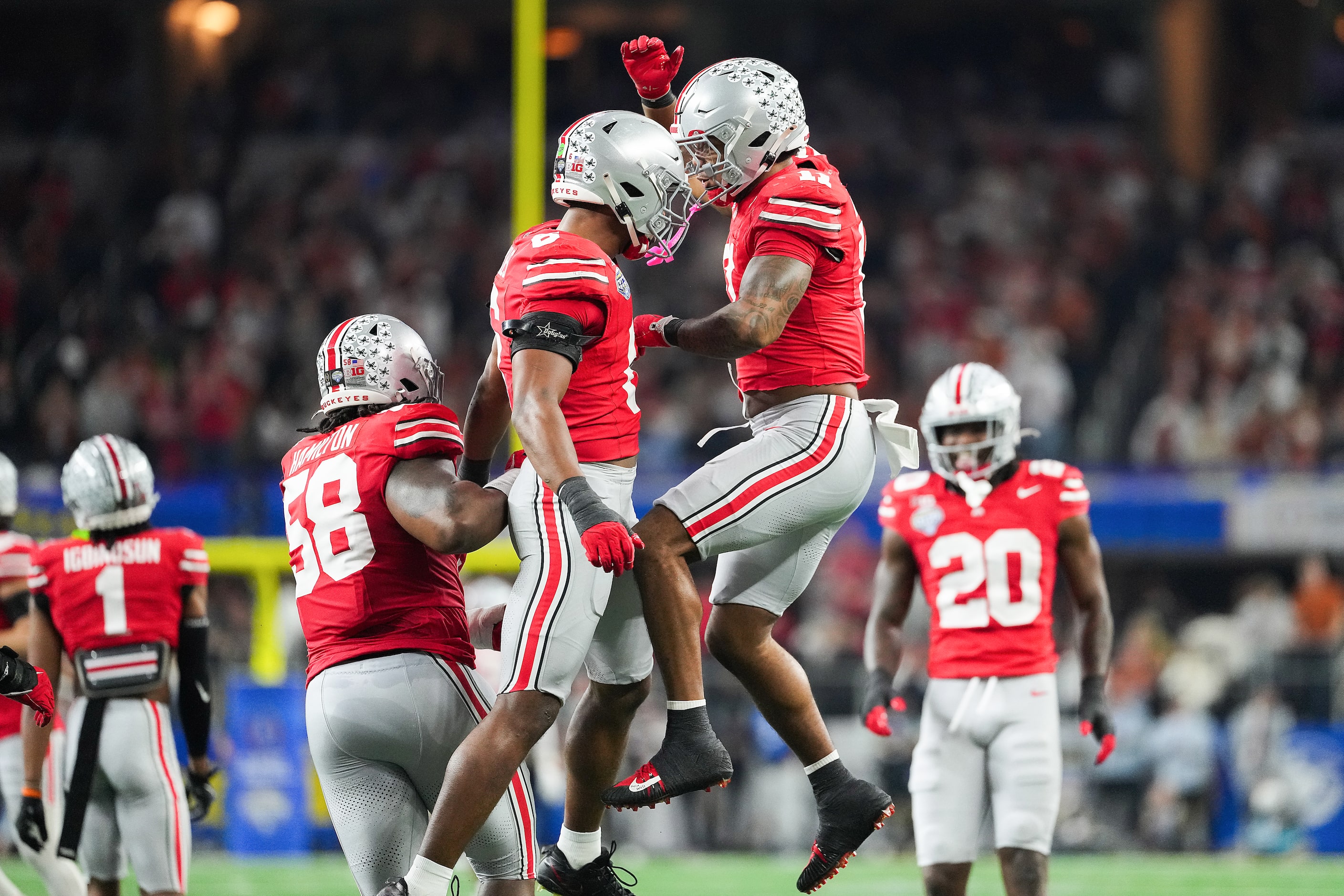 Ohio State safety Sonny Styles (6) celebrates a defensive stop with linebacker C.J. Hicks...