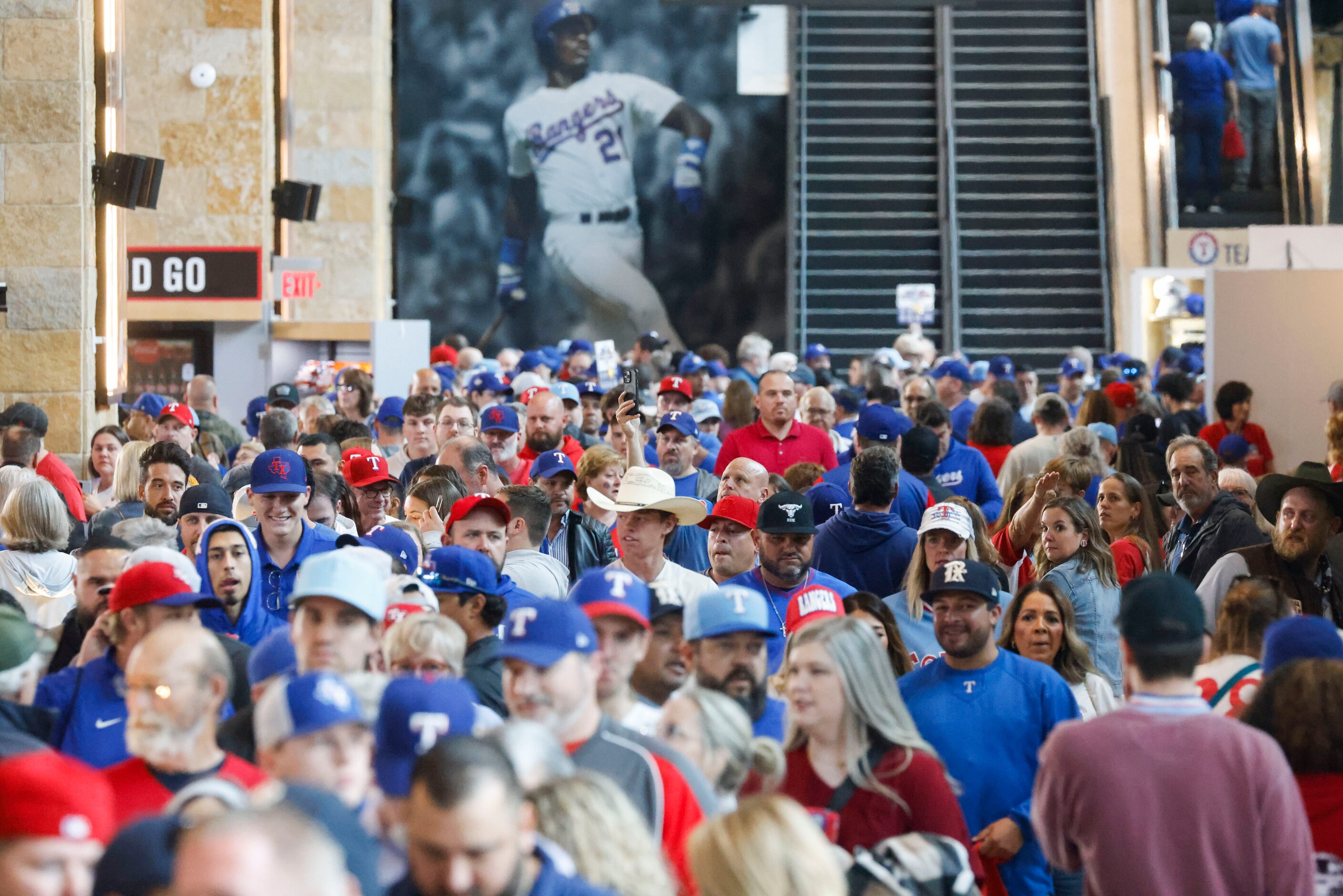 Fans make their way inside Globe Life Field ahead of Game 2 of the World Series between the...