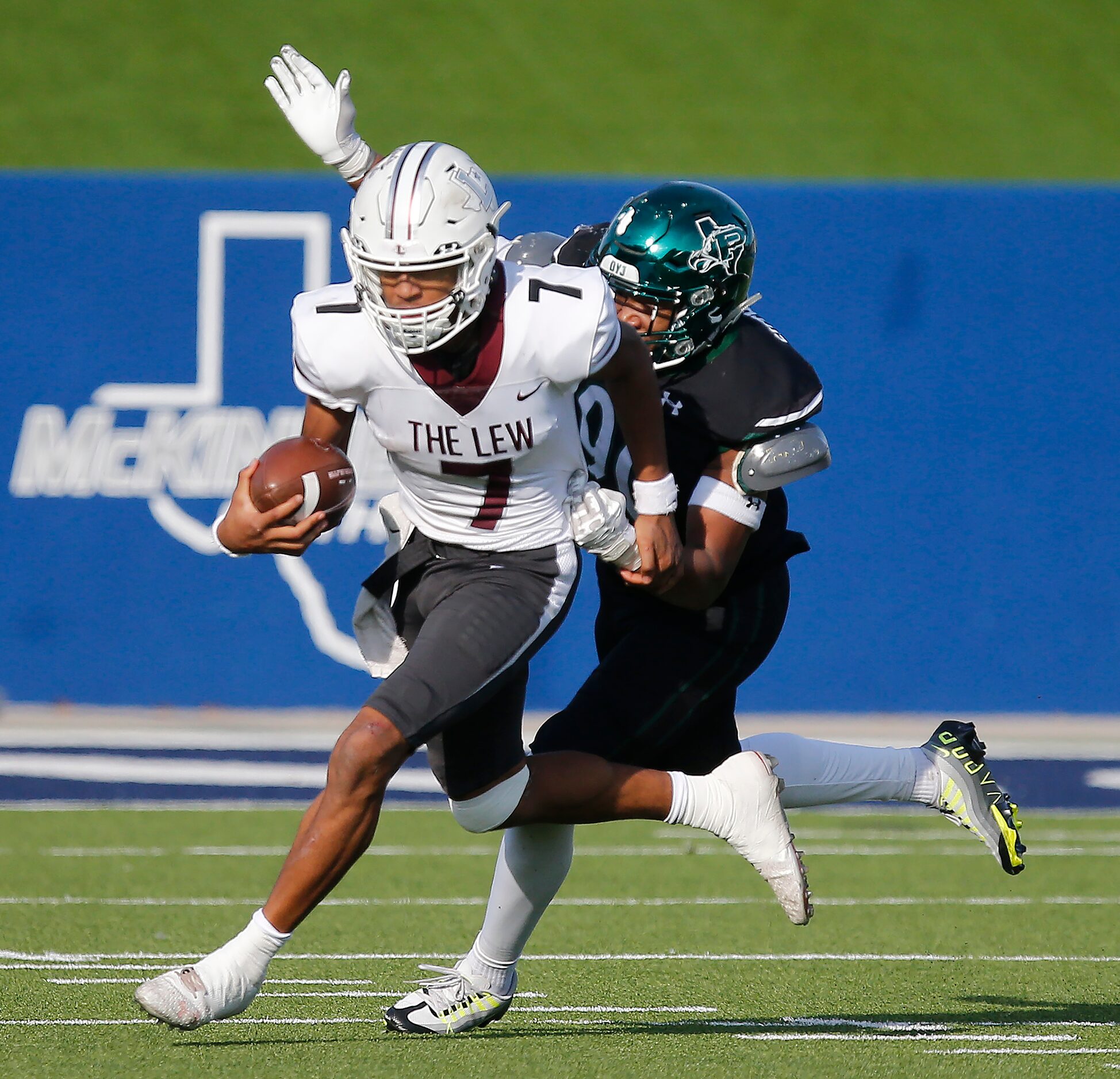 Lewisville High School quarterback Ethan Terrell (7) is tackled by Prosper High School...