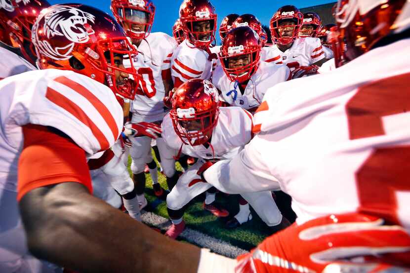 The Duncanville football team gets pumped up before racing onto the field to face Skyline at...