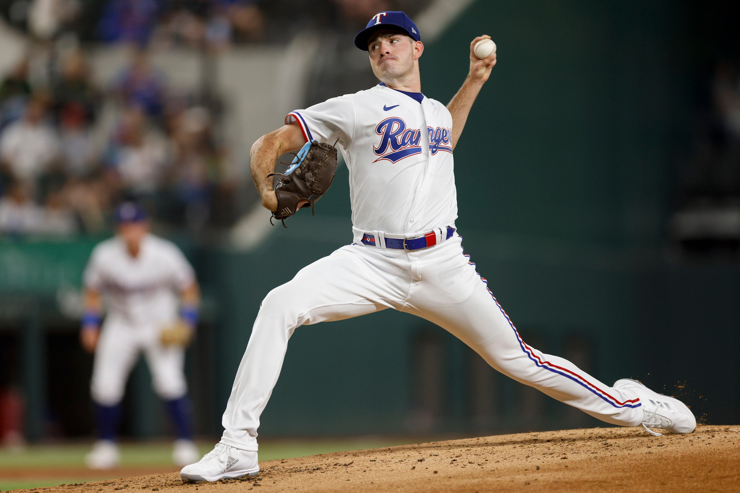 Texas Rangers starting pitcher Cody Bradford (61) delivers a pitch during the first inning...