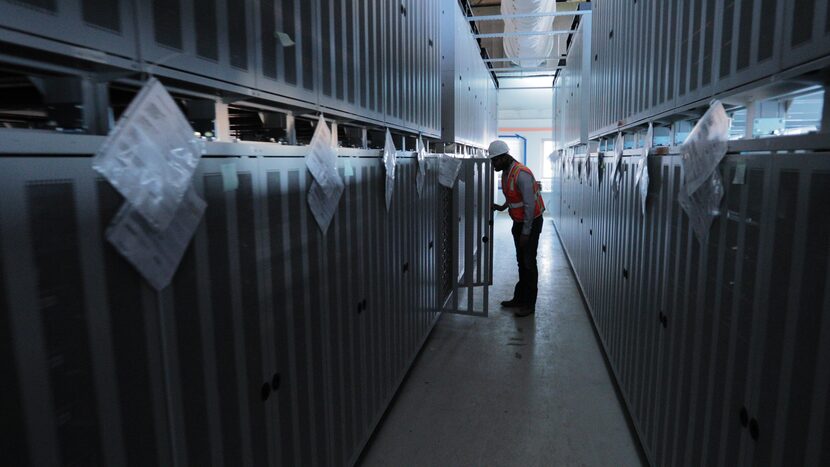 David Yeager, Vistra's project manager, checks out the new storage batteries at the Moss...