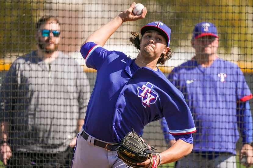 Rangers pitcher Tyler Phillips throws live batting practice during a spring training workout...