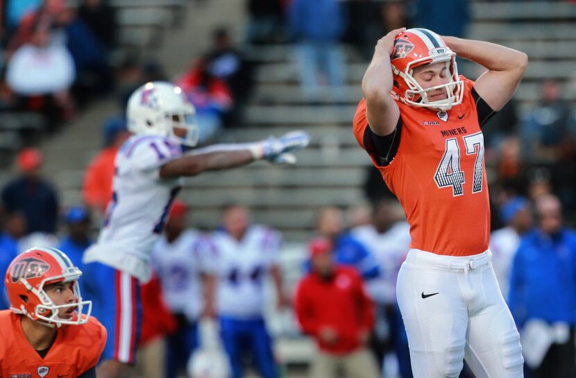 UTEP kicker Jay Mattox, right, reacts after missing the potential game-winning field goal...