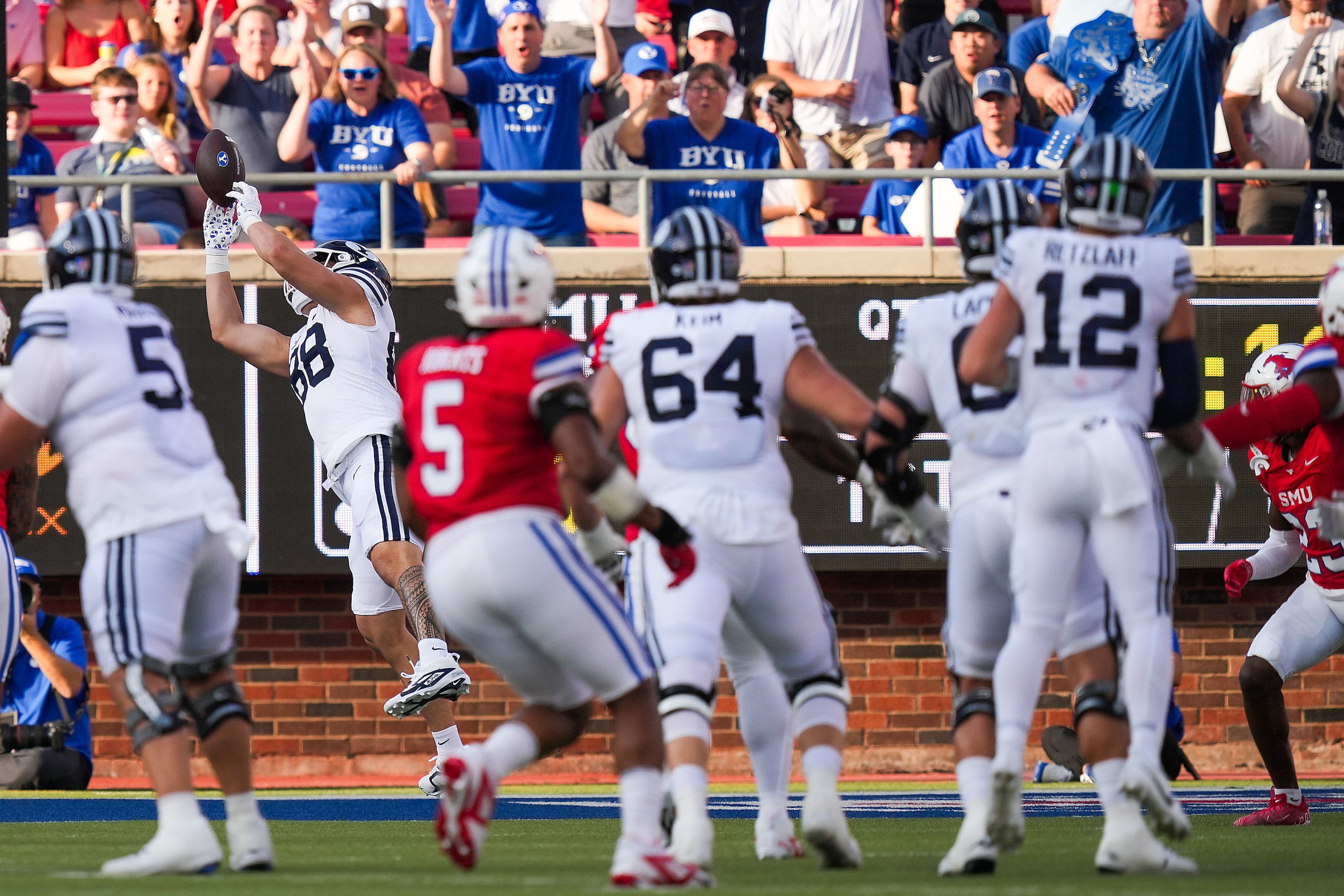 BYU tight end Mata'ava Ta'ase (88) catches a touchdown pass during the first half of an NCAA...