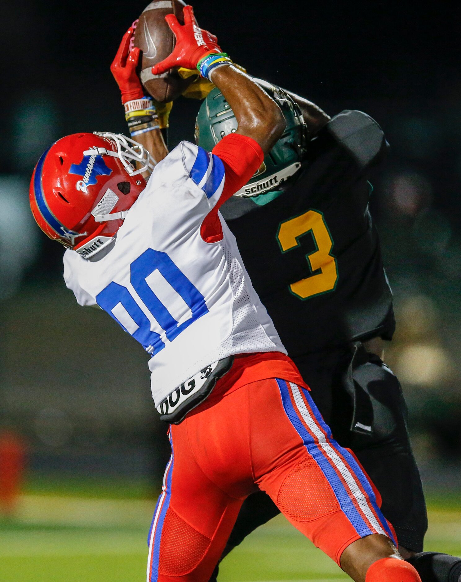 DeSoto senior defensive back Devyn Bobby (3) breaks up a pass intended for Duncanville...