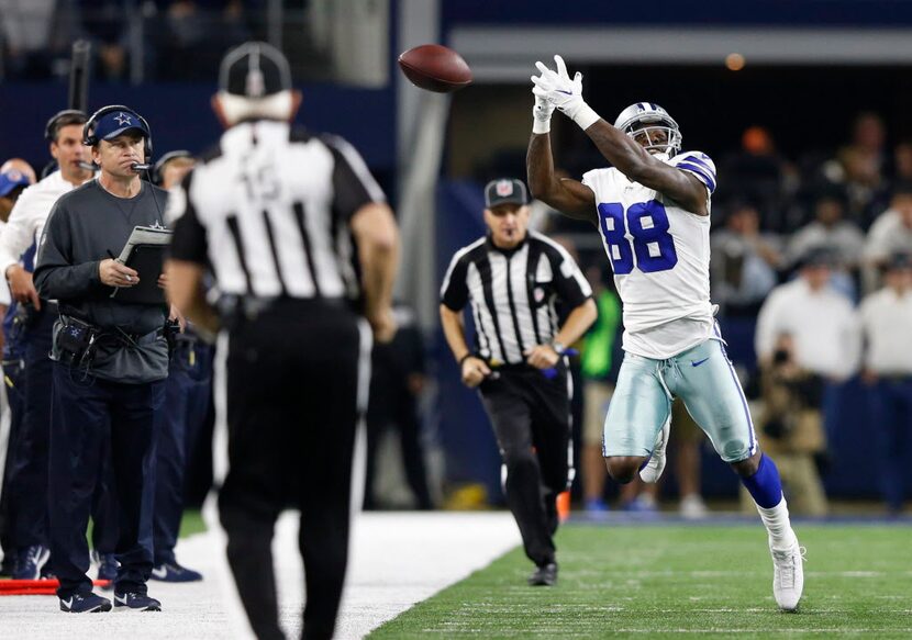 Dallas Cowboys wide receiver Dez Bryant (88) can't catch a ball near the sideline in a game...