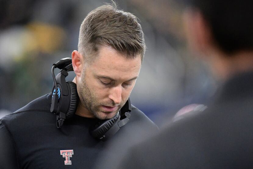Texas Tech Red Raiders head coach Kliff Kingsbury studies his play book during the fourth...