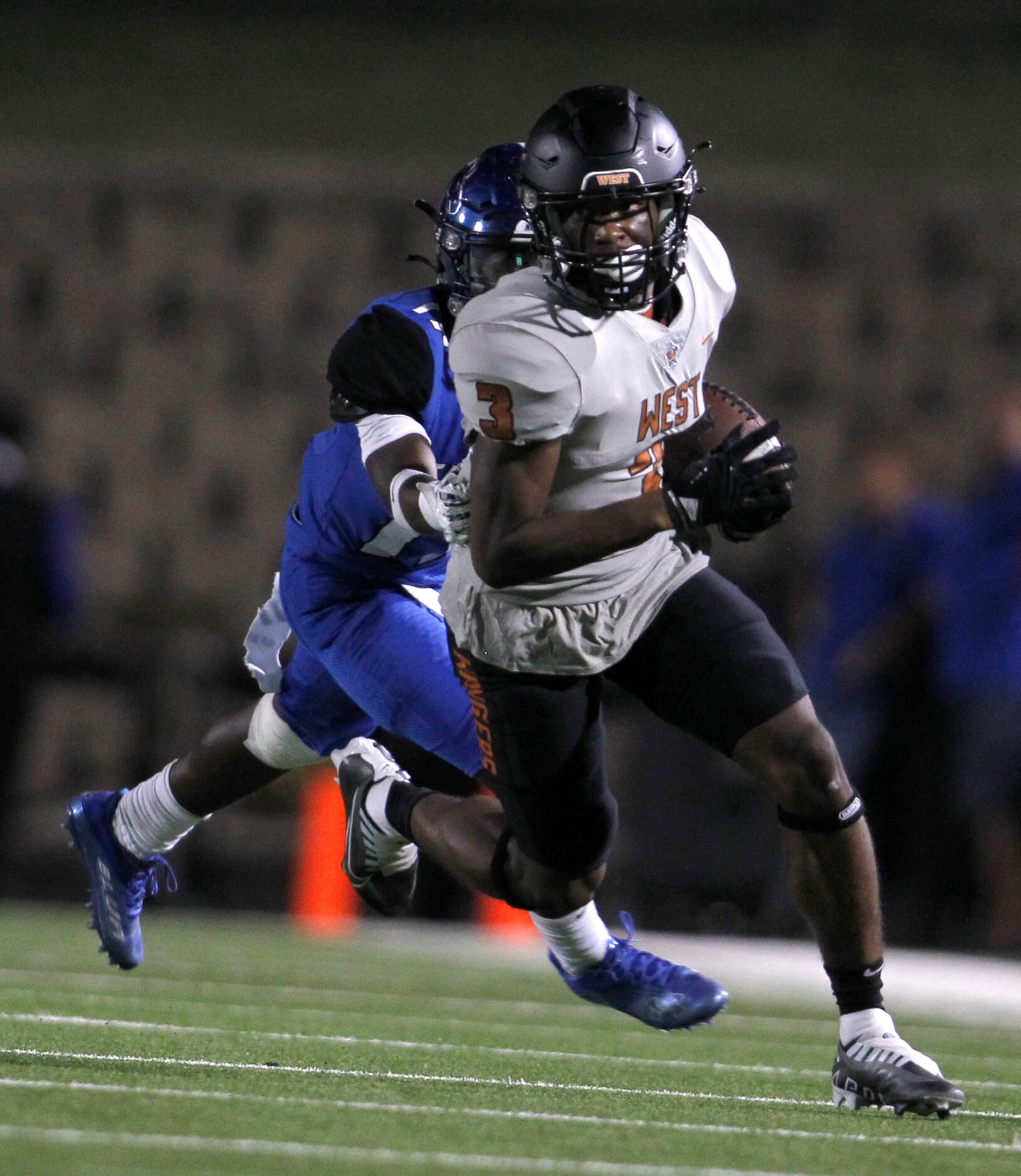 West Mesquite's Kasen McCoy (3) tacks on yardage after a reception as he is pursued by a...