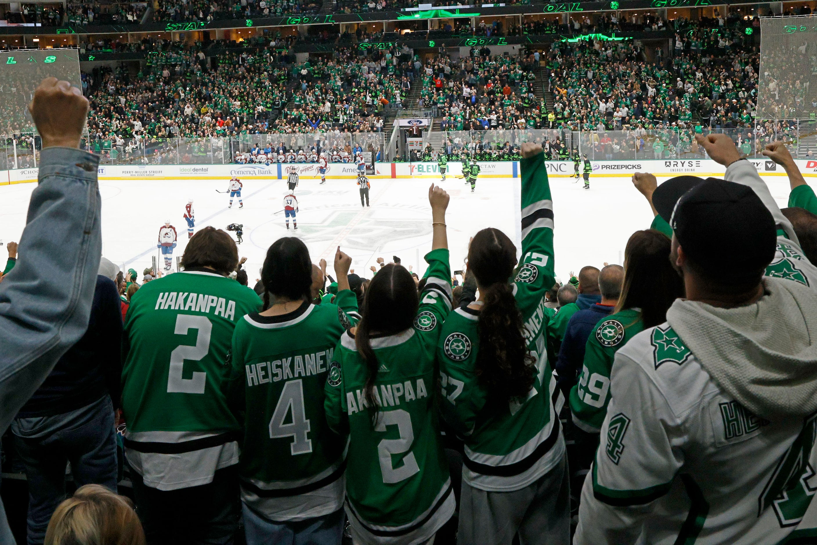 Fans celebrate after Dallas Stars left wing Mason Marchment (27) scores a goal against...