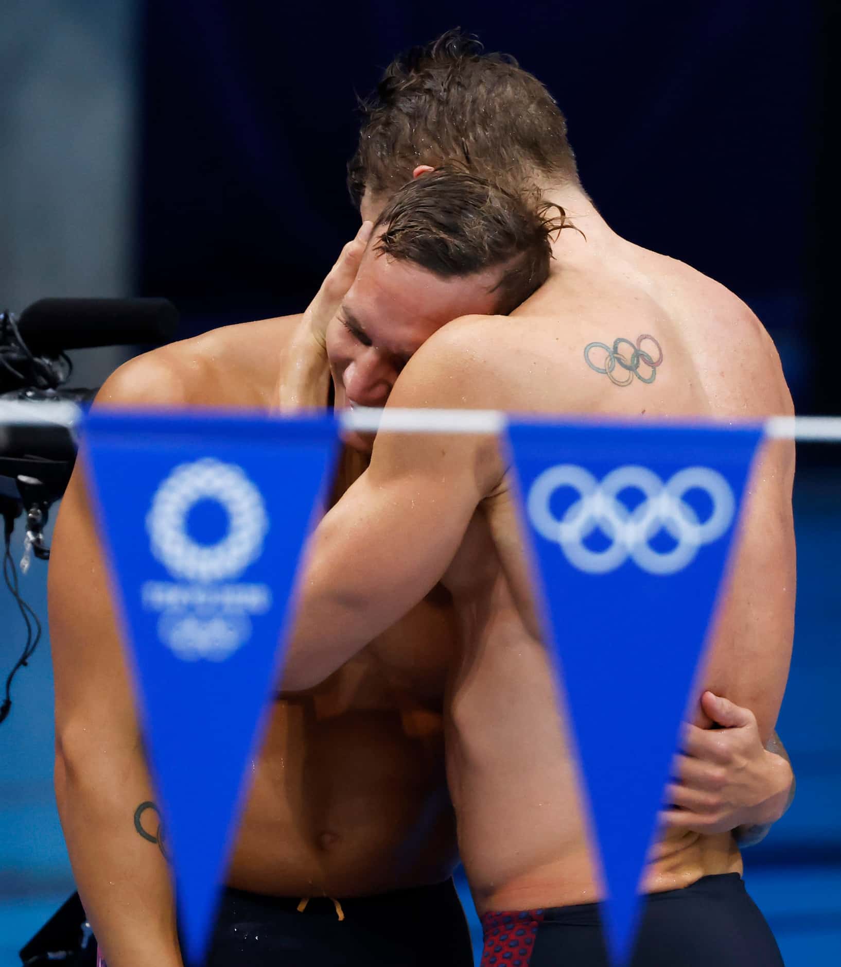 (Left to right) USA’s  Caeleb Dressel and Ryan Murphy hug after setting a new world record...