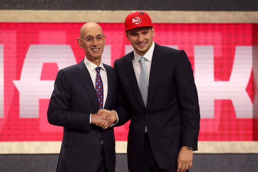 NEW YORK, NY - JUNE 21: Luka Doncic poses with NBA Commissioner Adam Silver after being...