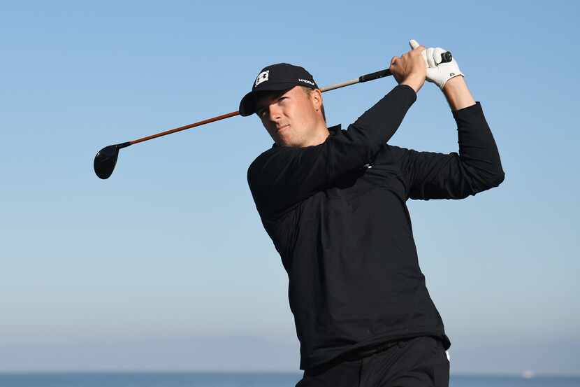 PEBBLE BEACH, CALIFORNIA - FEBRUARY 07:  Jordan Spieth of the United States plays his shot...