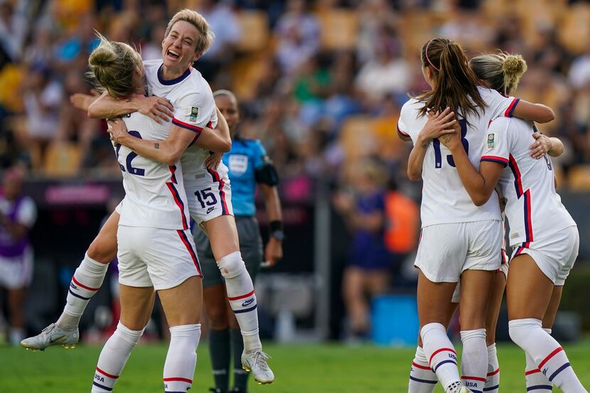 United States' players celebrate their side's third goal scored by Ashley Sanchez against...