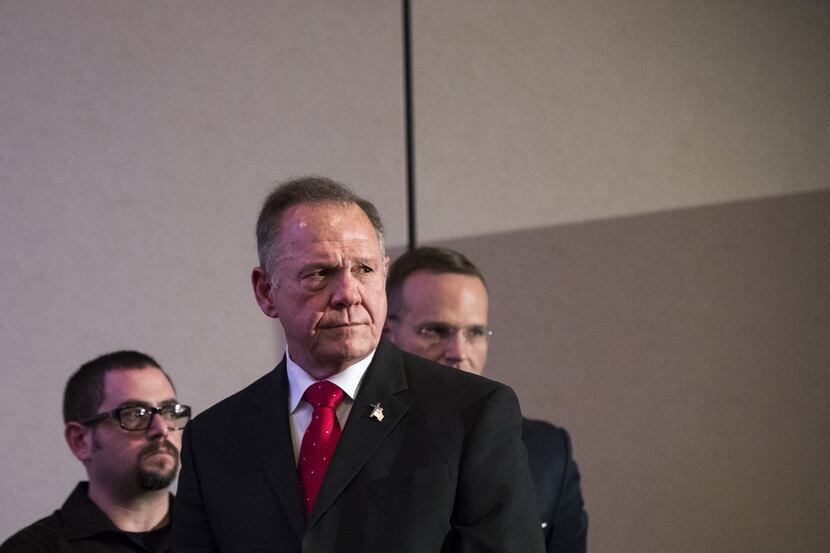 Republican candidate for U.S. Senate Judge Roy Moore listens to a question during a news...