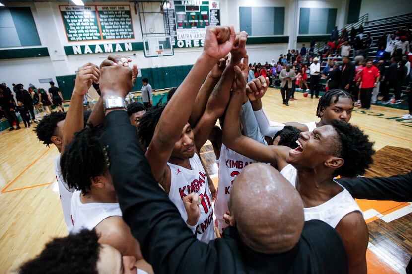 Kimball celebrates a 101-73 win over Newman Smith after a Class 5A Region II quarterfinal...