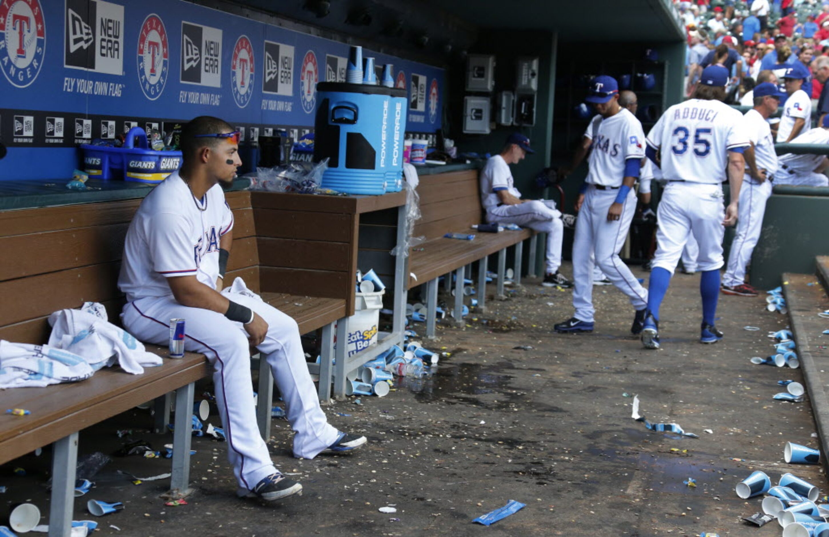 Texas second baseman Rougned Odor, left, remains on the bench as the Oakland Athletics...