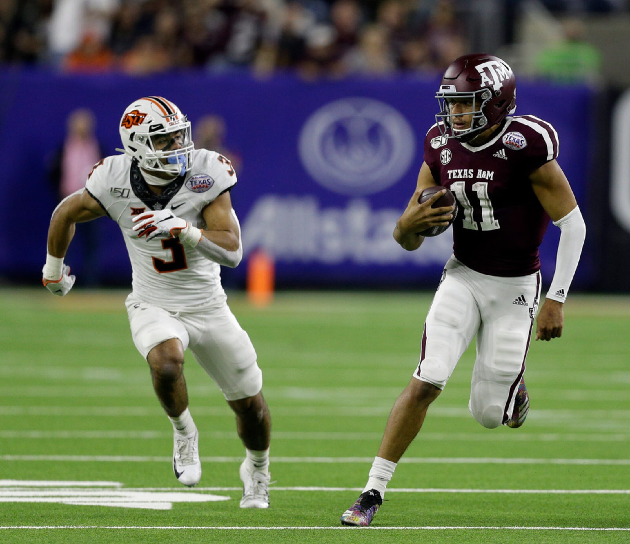 HOUSTON, TEXAS - DECEMBER 27: Kellen Mond #11 of the Texas A&M Aggies runs for 66 yards as...