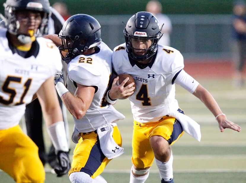 Highland Park High School quarterback Chandler Morris (4) looks for room to run during the...