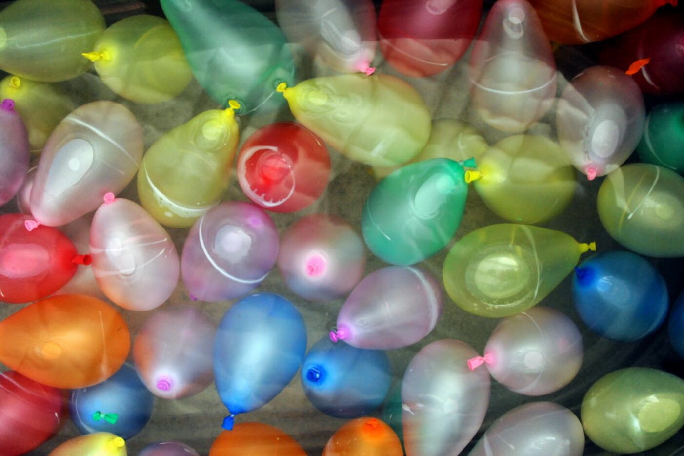 Water balloons sit ready for throwing at the Water Balloon War at Texas Ale Project in...