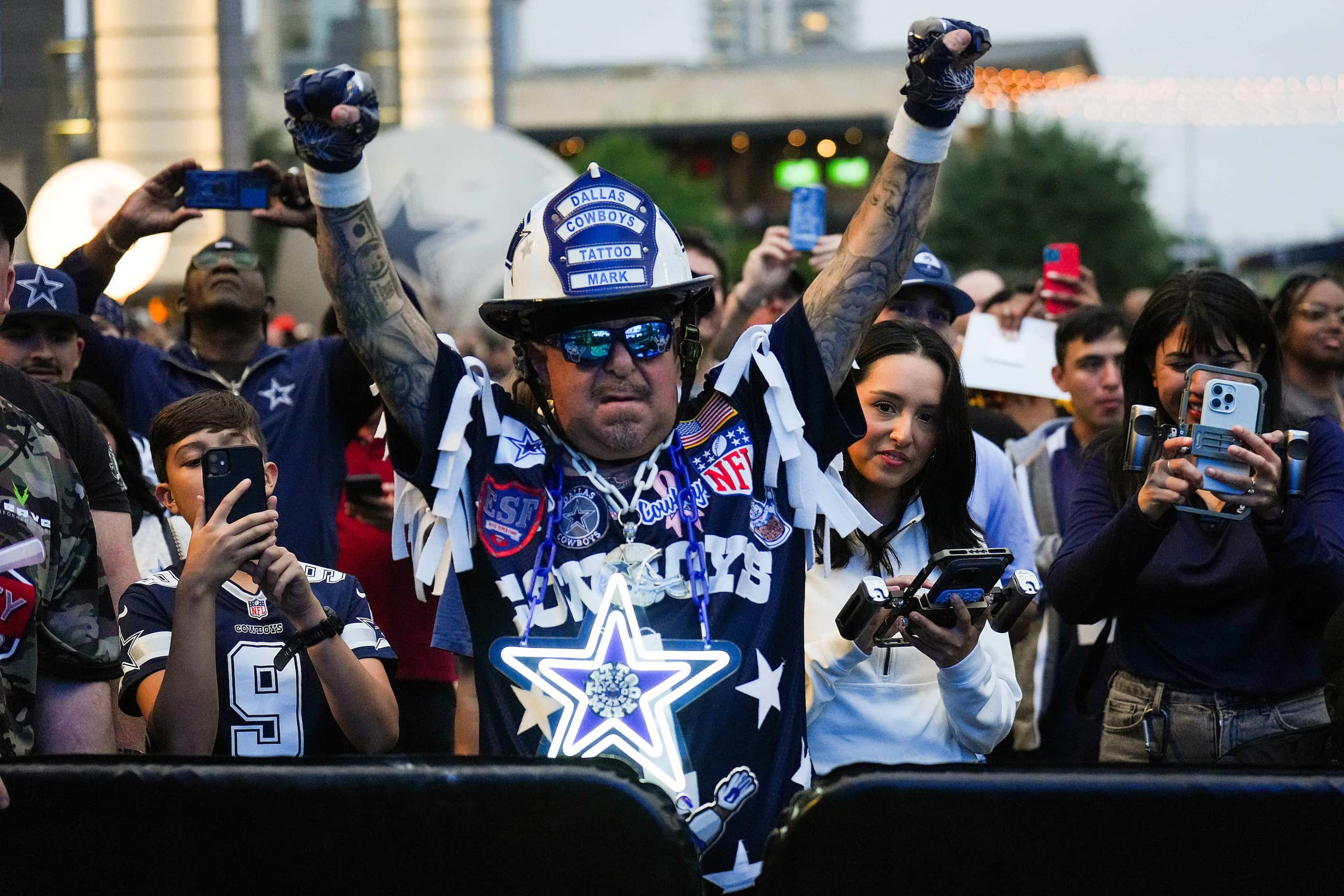 Dallas Cowboys fan Mark “Tattoo Mark” Shenefield cheers during a draft party for the first...