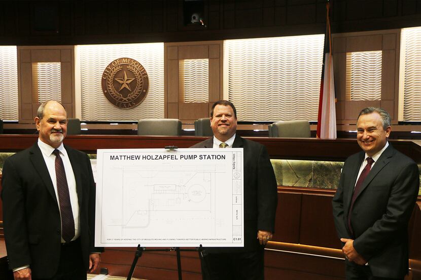 Matt Holzapfel poses with Mesquite Mayor Bruce Archer and City Manager Cliff Keheley after...