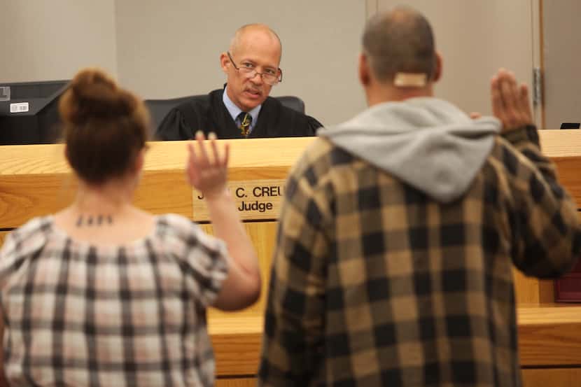 State District Judge Judge John Creuzot in his courtroom at Crowley Courts Building on...